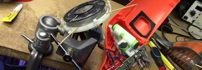 Vacuum cleaner repair parts and tools on a workbench in Wilmington, NC